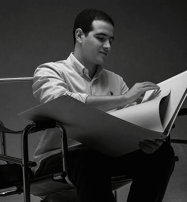 Oussama Boudokhane reviewing architectural drawings